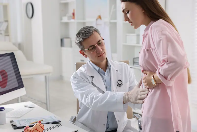 Gastroenterologist examining patient